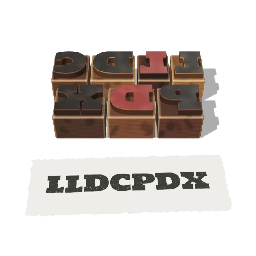 Wooden letterpress type blocks spelling LLDCPDX, set in reverse, above a paper proof printed with LLDCPDX